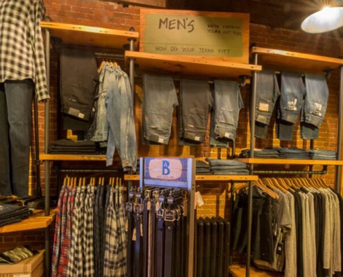 a rack of designer denim in our mens clothes section